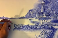 a person is drawing a lighthouse in blue ink